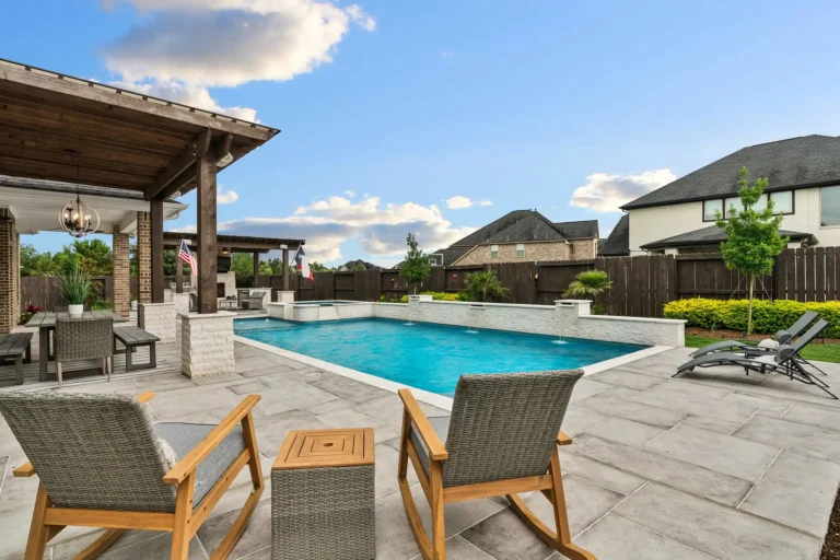 best pool deck material Texas concrete vs pavers pool deck pool deck options DFW - pool upgrade water feature retrofit waterfall pool add bubbler to pool DFW outdoor living