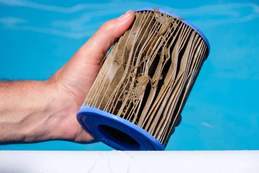 cartridge pool filter cleaning frequency, how often clean pool cartridge filter, dirty pool cartridge symptoms, cartridge filter maintenance, pool cartridge lifespan