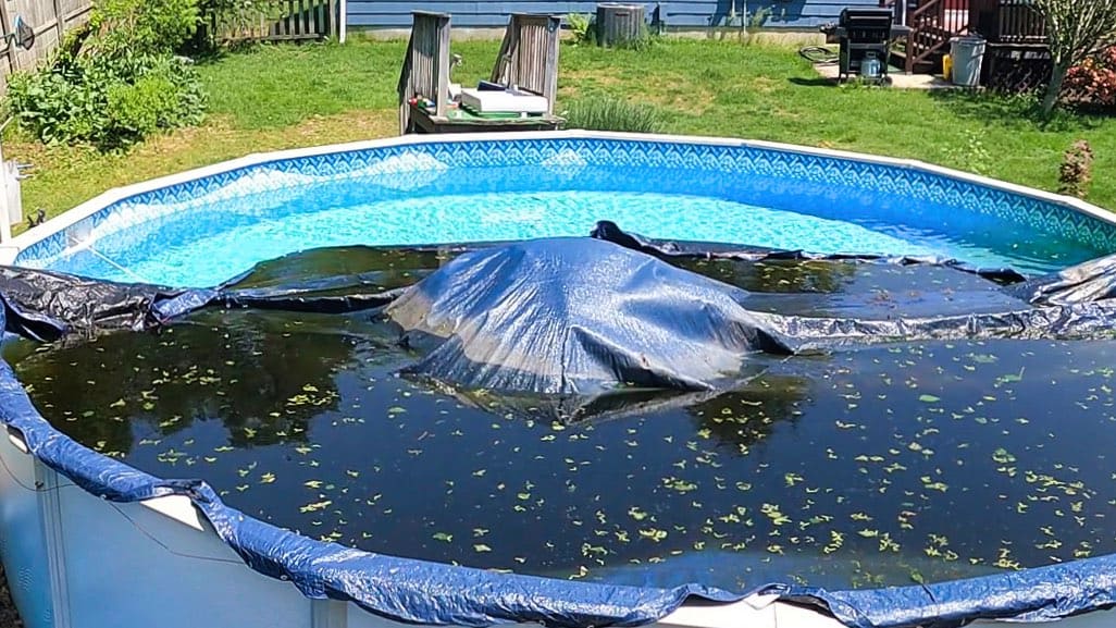 pool cover water removal, water on pool cover, remove water from pool cover, pool cover pump, winter pool cover water