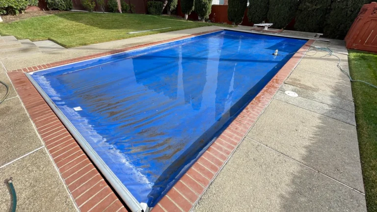 automatic pool cover track cleaning, automatic pool cover track maintenance, pool cover track debris, automatic cover stuck, pool cover - torn pool cover repair, pool cover tear, ripped pool cover, pool cover patch, pool cover replacement