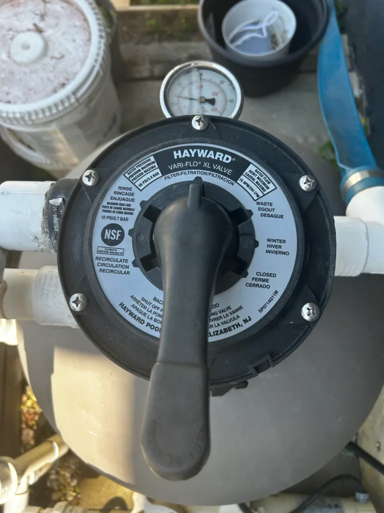 pool filter sand in pool, sand coming back into pool, sand filter laterals, pool filter sand problem, sand in pool after backwash